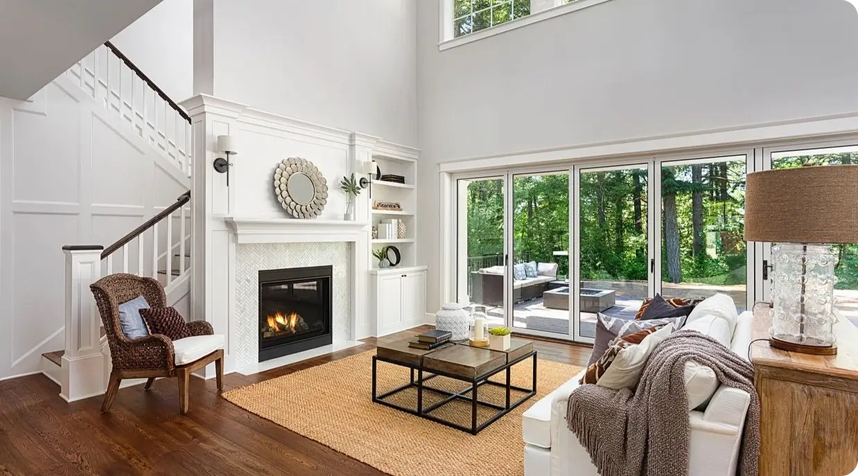 A living room with a fireplace and sliding glass doors.